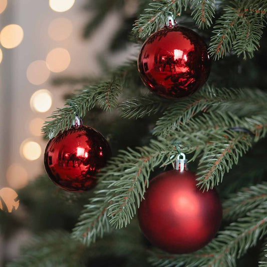 Red shatterproof Christmas baubles in convenient box