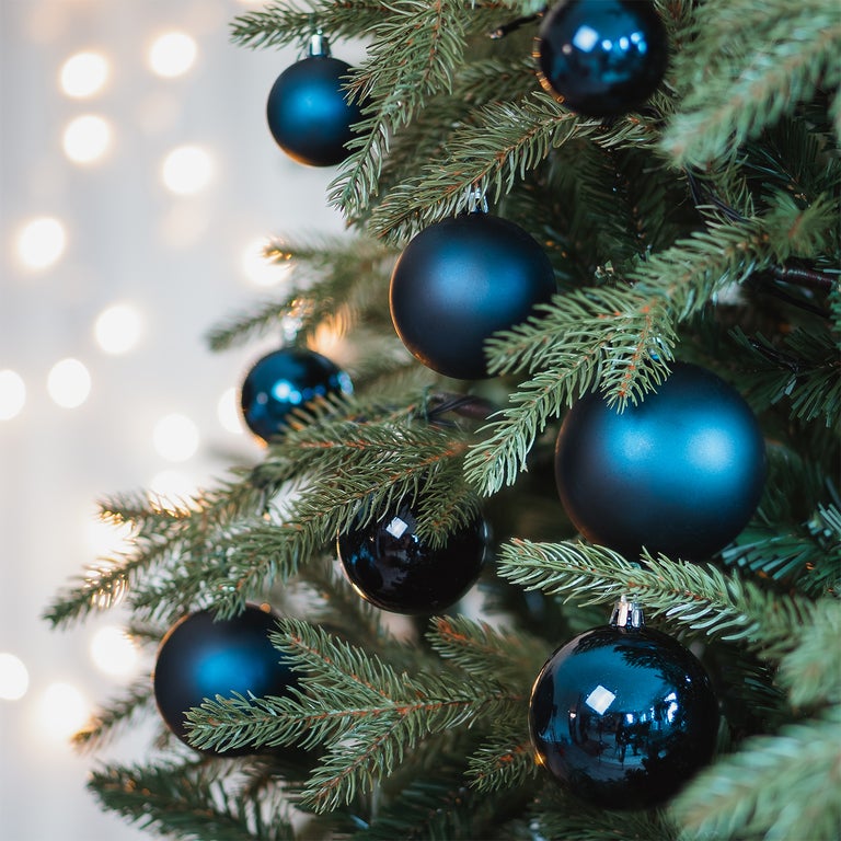 Dark blue set Christmas baubles in storage tube